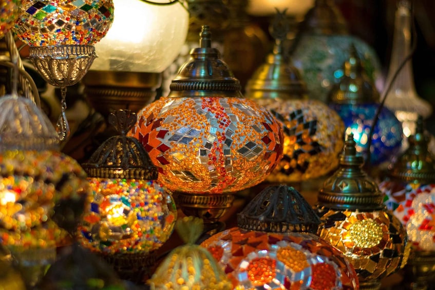 A collection of colorful, mosaic-patterned lamps. 1