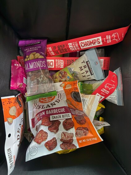 A variety of packaged food items including snacks and meats. 4