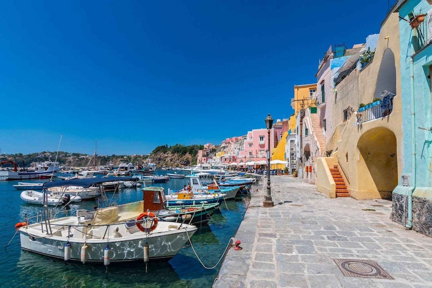 A harbor with colorful buildings and boats docked along the waterfront. 4