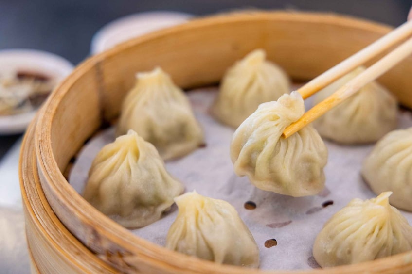 A bamboo steamer with dumplings. 2