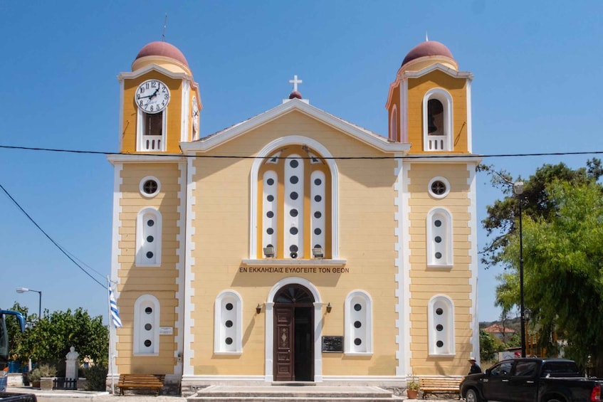 A church with two domed towers and a central arched window. 4