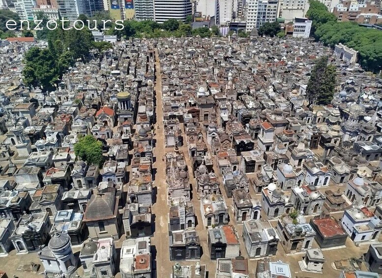 An aerial view of a densely packed cemetery with numerous tombs and mausoleums. 5