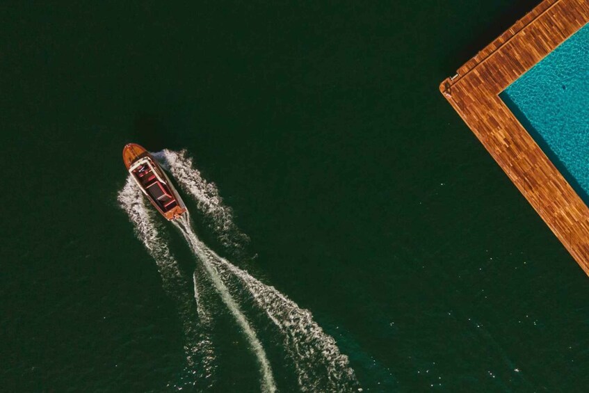 A boat moving through water, leaving a wake behind it. 5