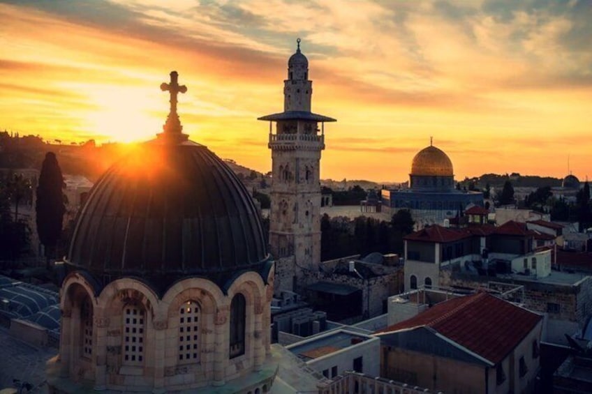 A cityscape with a prominent mosque, a dome, and a minaret. 5