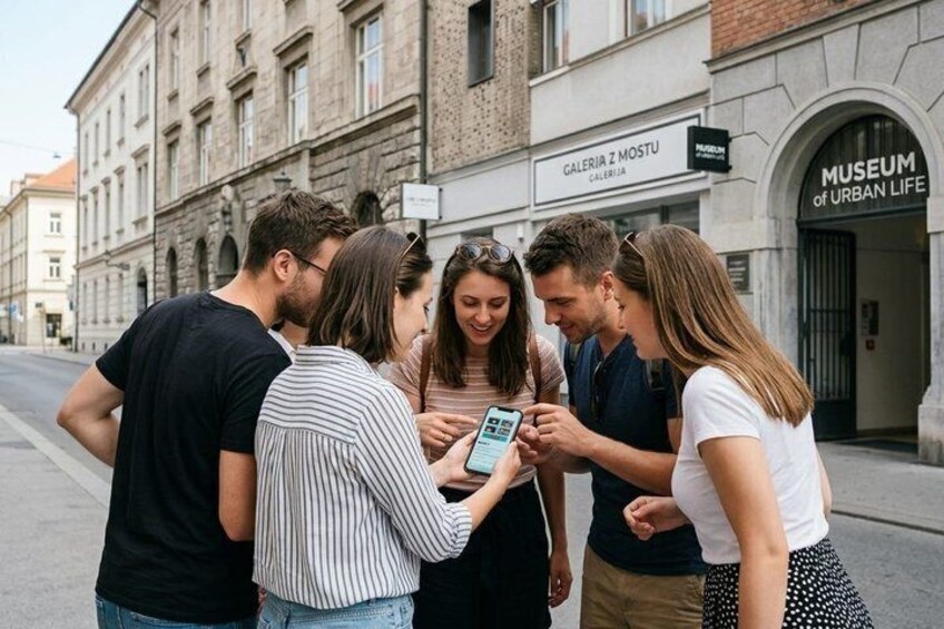 A group of people standing on a street, looking at a smartphone. In the background, there is a building with a sign that reads 'MUSEUM of Urban Life.' 4