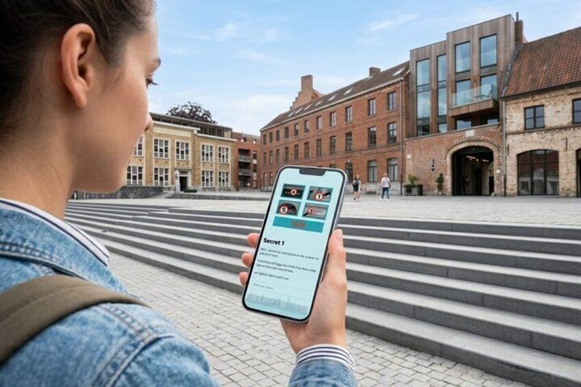 A person holding a smartphone with a map application, standing in front of a building with a brick facade and large windows. 1