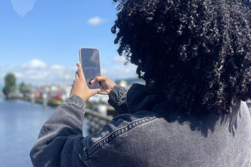 A person taking a photo with a smartphone. 3