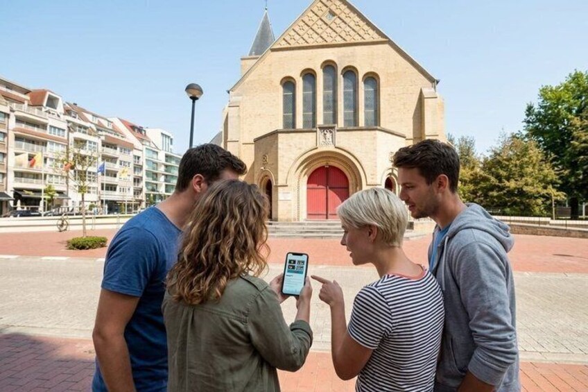 A group of people standing in front of a church with a red door and a bell tower. 1