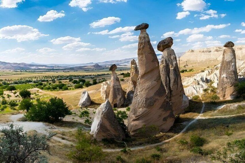 Rock formations in a desert landscape with a clear sky. 4