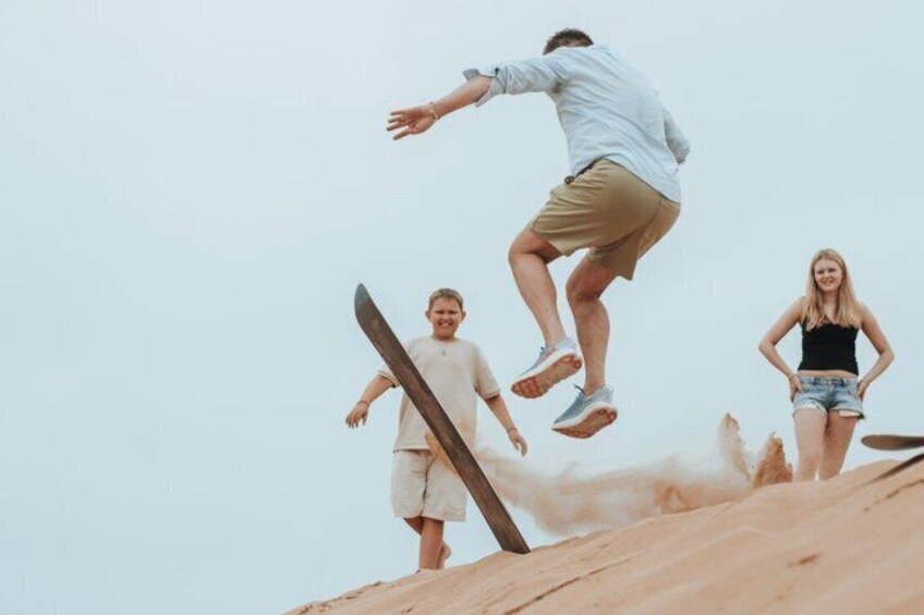A person jumping off a wooden ramp. 1