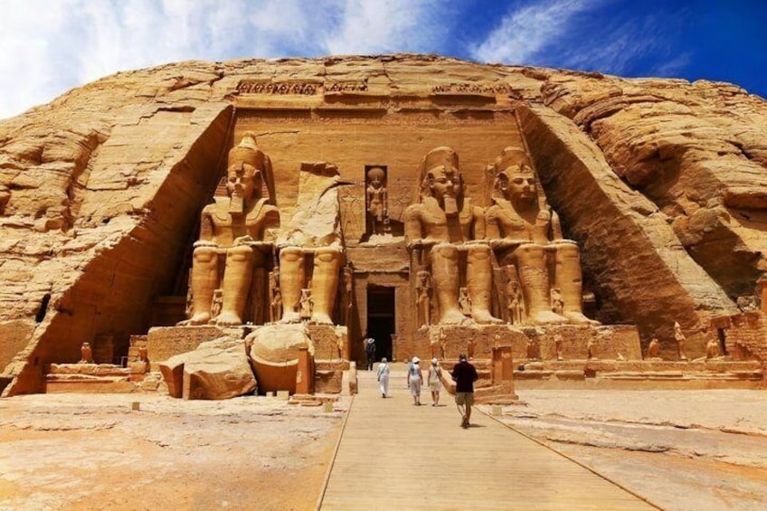 The entrance to the Temple of Karnak, featuring large statues and hieroglyphics. 2