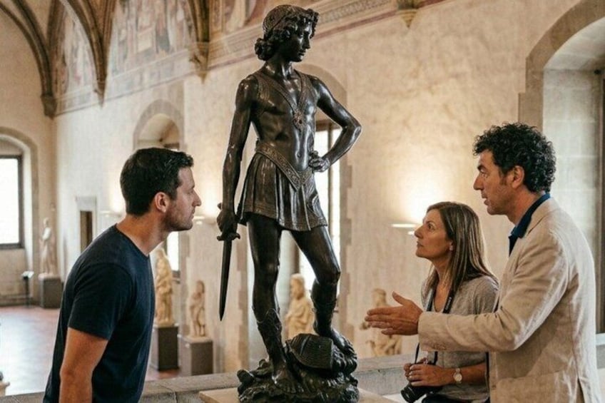 A statue in a museum with marble walls and classical architecture. 2