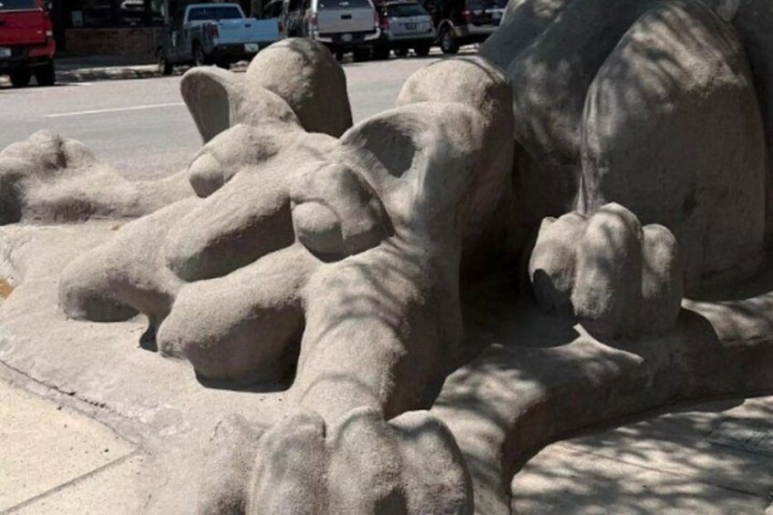 A large sand sculpture of a bear. 3