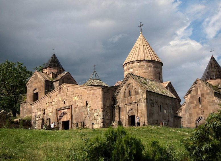 A historic church with multiple domes and a bell tower. 2