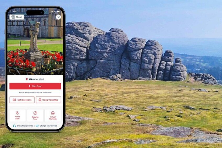 A smartphone displaying a tour app interface with a scenic landscape in the background. 1