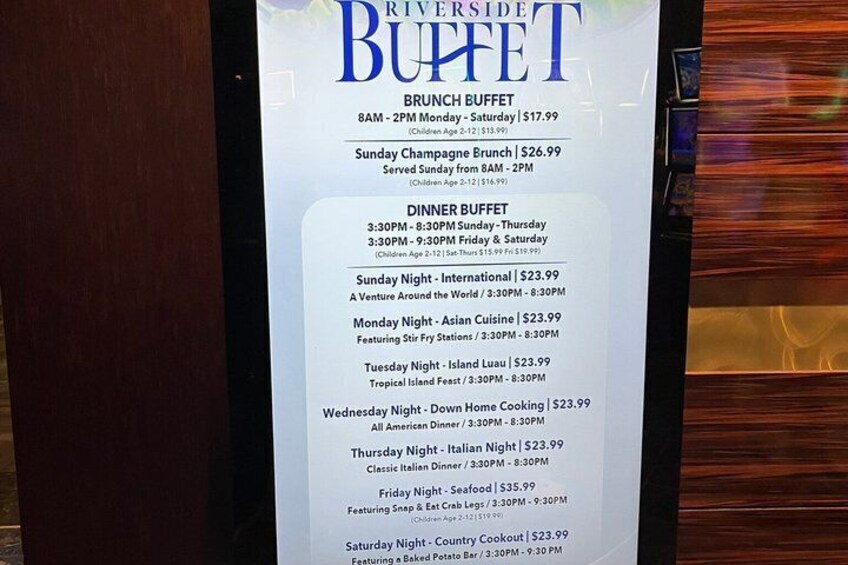 A menu board for Riverside Buffet with brunch and dinner options. 3
