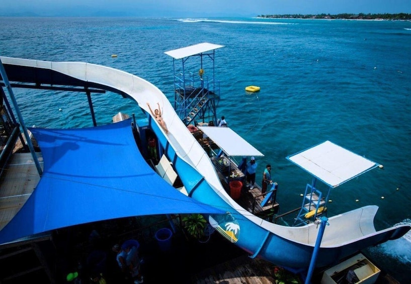 A boat with a blue canopy, a lifebuoy, and a small platform with a railing. 3