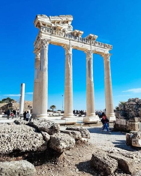 Ancient Greek columns with tourists in the foreground. 2