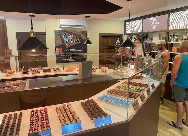 A chocolate shop with various confections on display. 2