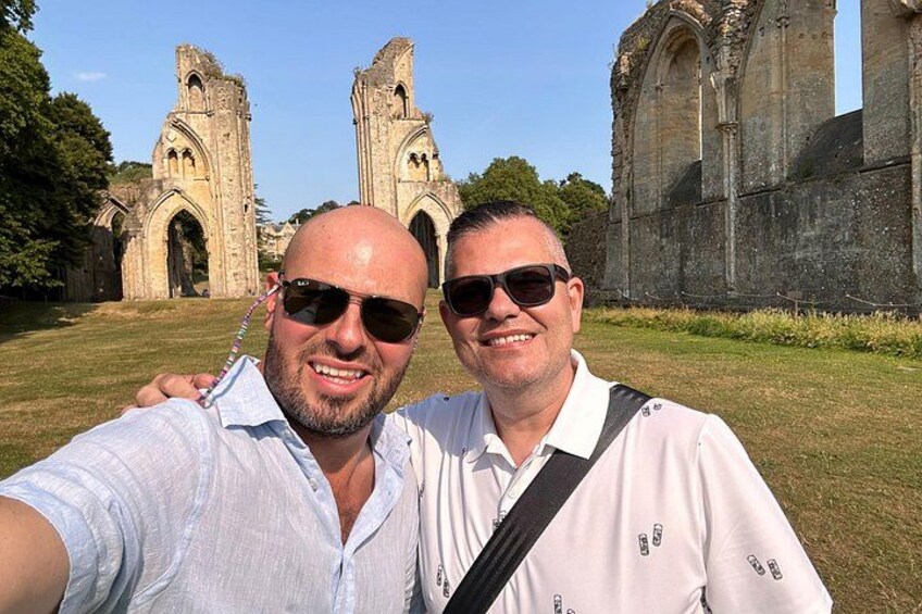 Two people taking a selfie with a historic church in the background. 5