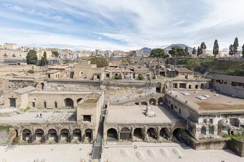 Ancient ruins with arched walkways and a central staircase. 1