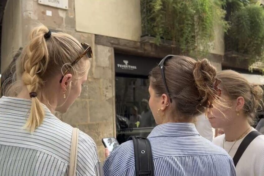 Three people with braided hair, one wearing sunglasses, standing in front of a building with a sign that reads 'Furnace.' 1