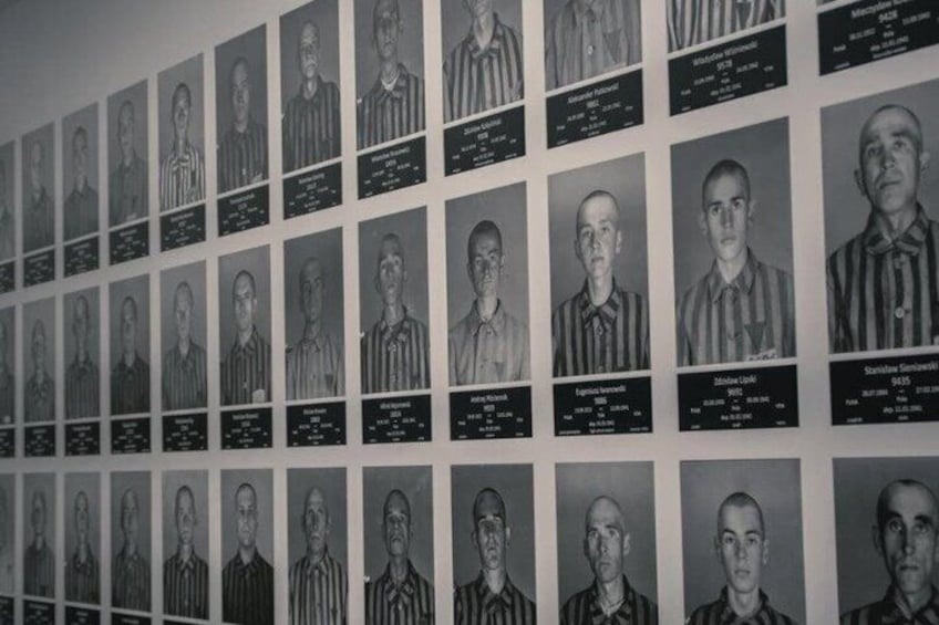 A wall of black and white portraits with names and dates. 5