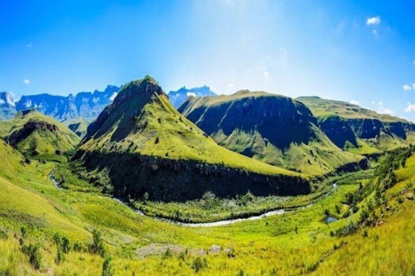 A mountainous landscape with a valley and a river. 3