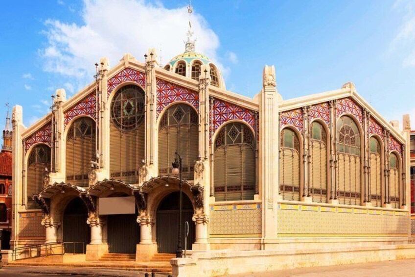 A historic building with ornate arches and a dome. 4