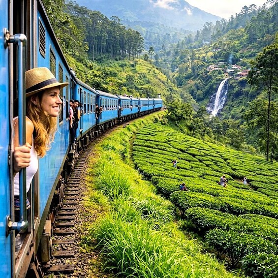 A train with passengers, winding through lush green tea plantations and a waterfall in the background. 2