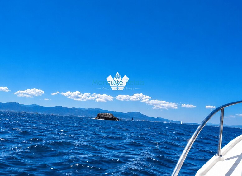 A boat on a clear blue sea with mountains in the distance and a logo for 'Monsuite Relais' in the center. 2