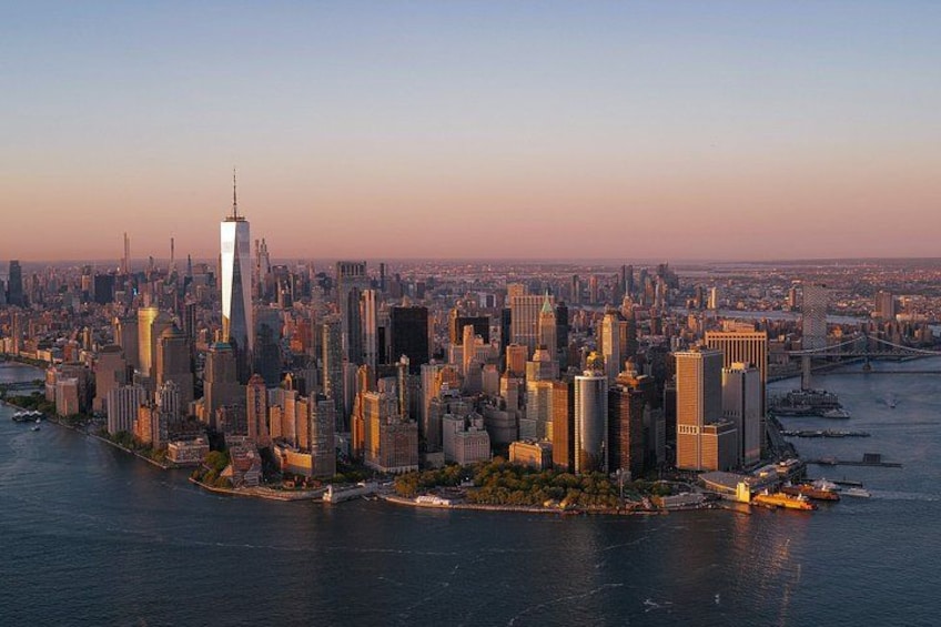 A city skyline with a prominent skyscraper, a river, and a bridge. 5