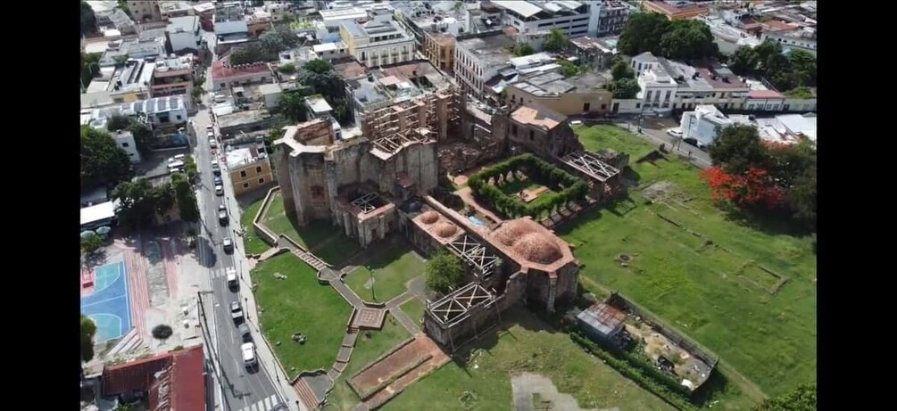 An aerial view of a historic building complex with ruins and a large dome structure. 5