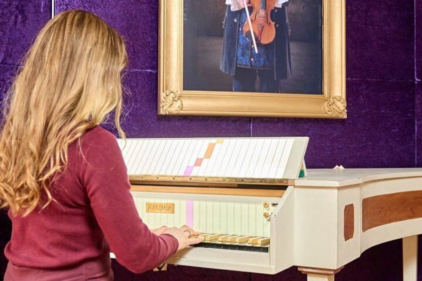 A person playing a piano with sheet music. 3