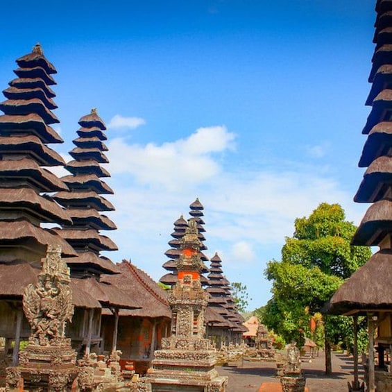 A temple complex with tiered roofs and traditional Balinese architecture. 3