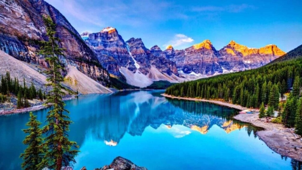 A mountain lake surrounded by forest and rocky cliffs. 3