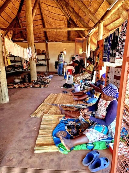 A market stall with woven baskets and textiles. 5