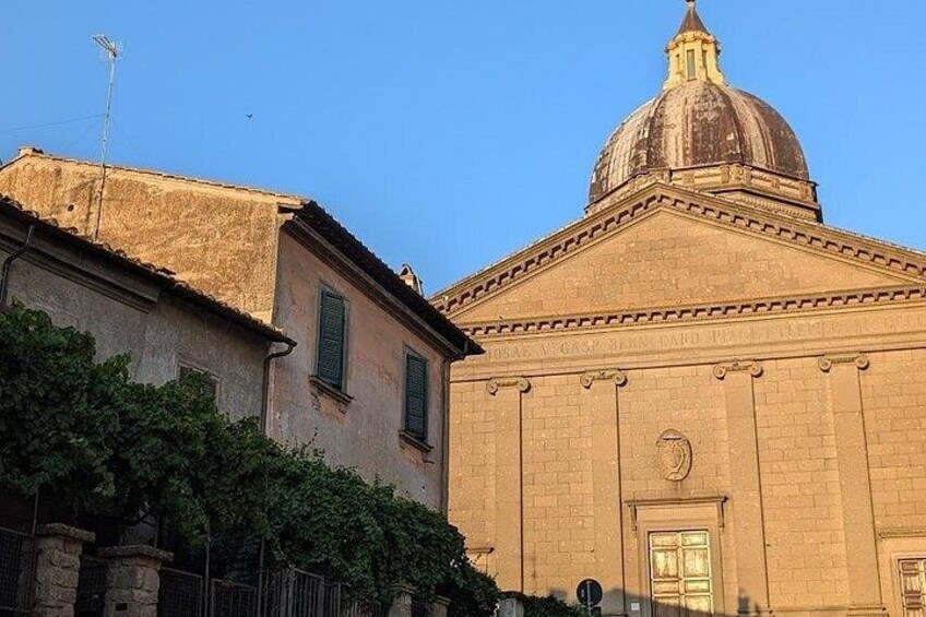 A building with a dome and a smaller building with a sloped roof. 4
