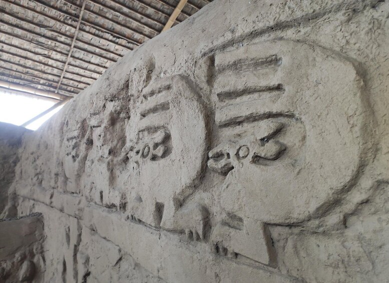 Ancient stone carvings on a wall. 5