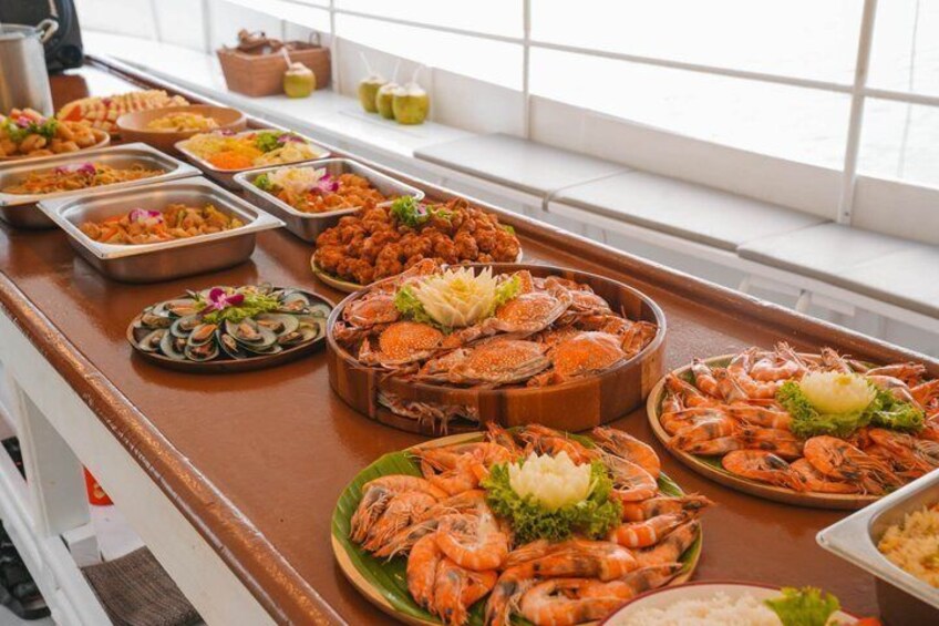A buffet with seafood, including shrimp and crab, and various side dishes. 5