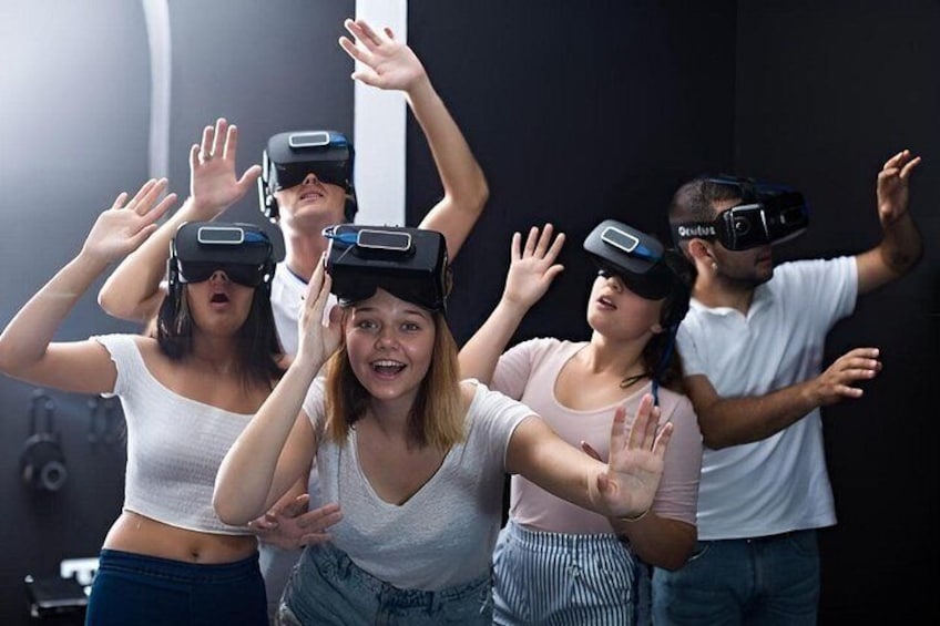 People wearing virtual reality headsets. 2