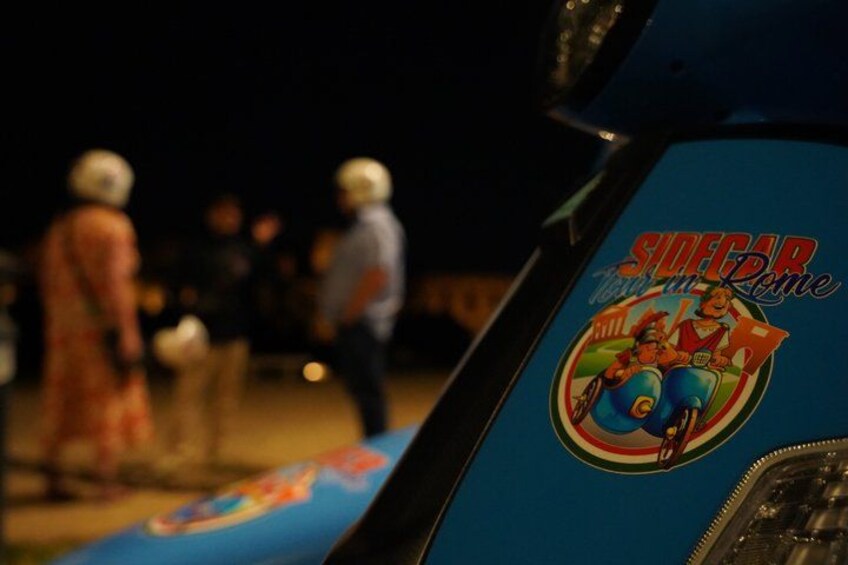 A blue motorcycle with a sticker that reads 'SIDECAR' and 'MILLER RIDE'. 4
