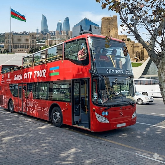 A red double-decker bus labeled 'Baku City Tour' with a cityscape in the background. 5