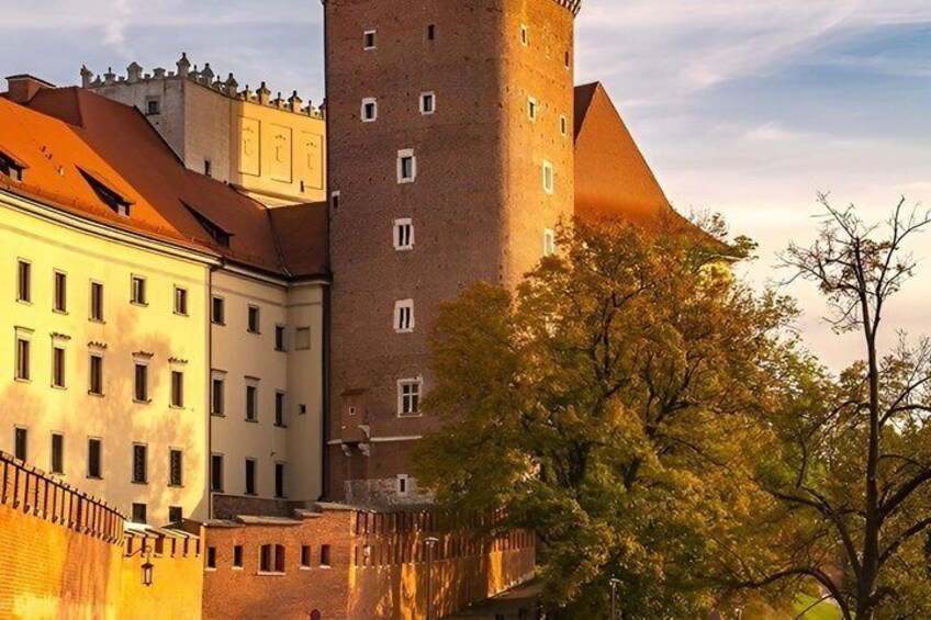 A historic building with a tower, surrounded by trees and other architecture. 3