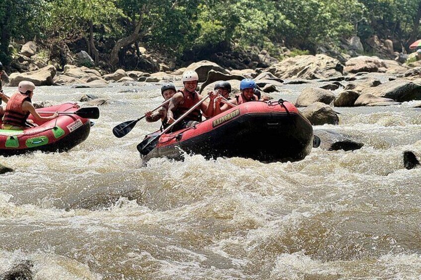 People rafting on a river with rapids. 4
