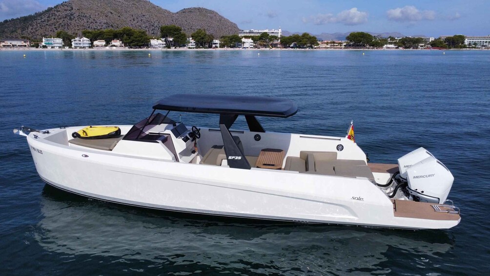 A white motorboat with a canopy, a yellow life preserver, and a Mercury outboard motor on a calm body of water. 1