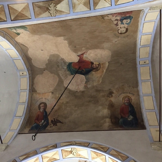 A ceiling fresco with religious figures and geometric patterns. 2