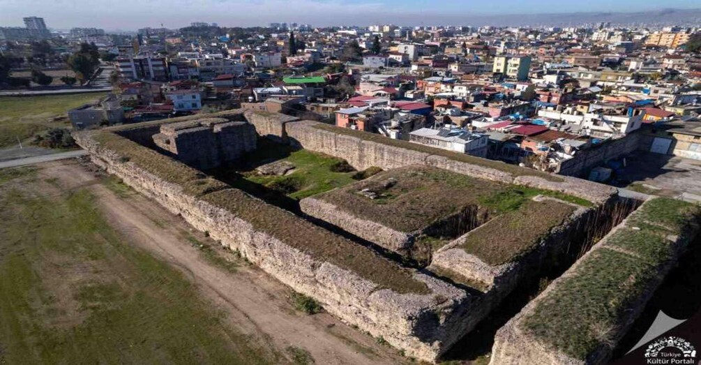 An aerial view of a historic fort surrounded by a densely populated urban area. 3