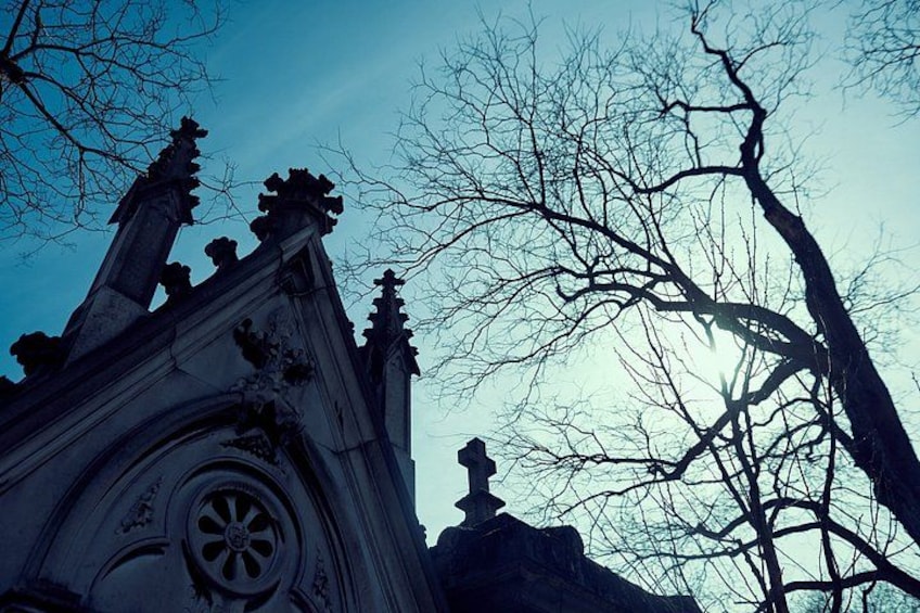 A gothic architectural structure with intricate carvings and a circular window. 3