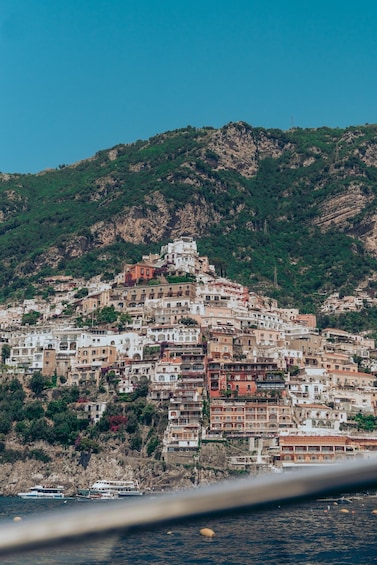 A coastal village with terraced buildings. 2